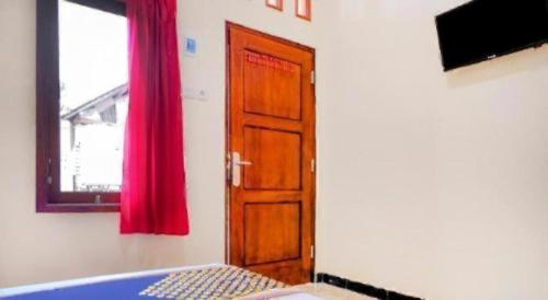 Giường trong phòng chung tại Hotel O Panderman Residence