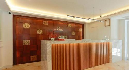 a kitchen with a counter in a room at London Hotel in Macau