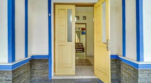 an open door to a room with a hallway at Hotel O My Guest House Syariah in Bandung