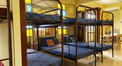 a couple of bunk beds in a room at Hotel O Arriva Travellers in Kuching