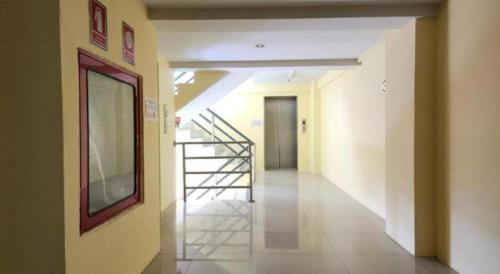 a hallway with a staircase in a building at ONE Residence in Pathum Thani
