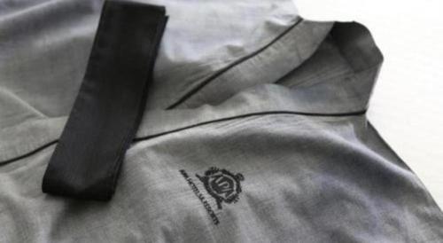 a close up of a shirt with a black tie at APA Hotel Chiba Inzaimakinohara-Ekimae in Narita