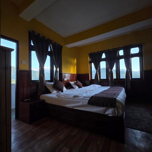 Cama o camas de una habitación en Sikkimese Inn Pelling