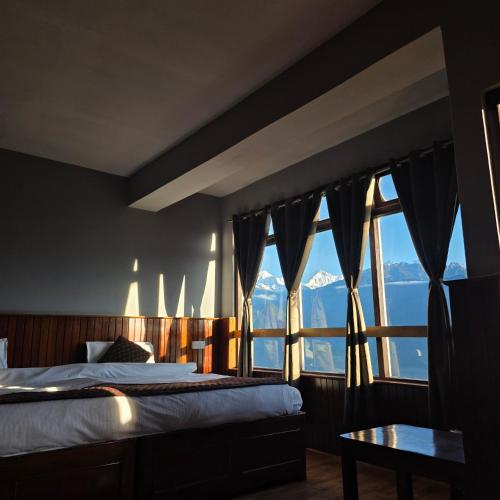 Letto o letti in una camera di Sikkimese Inn Pelling