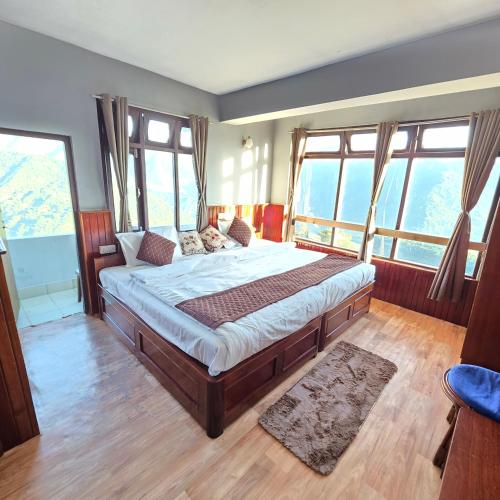 Letto o letti in una camera di Sikkimese Inn Pelling