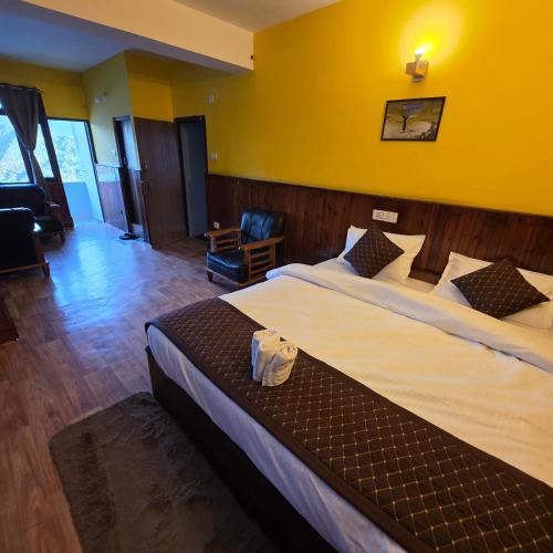 Letto o letti in una camera di Sikkimese Inn Pelling