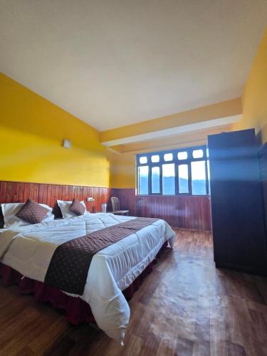 Letto o letti in una camera di Sikkimese Inn Pelling