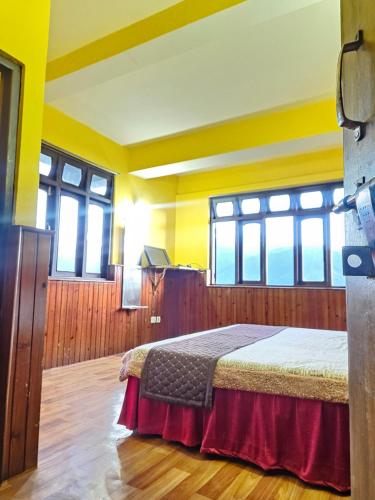 Letto o letti in una camera di Sikkimese Inn Pelling