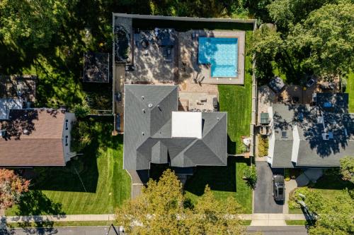 an overhead view of a house with a roof at Luxury 6BR House with Pool & Outdoor BBQ in Plainview