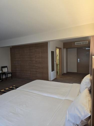 Ένα ή περισσότερα κρεβάτια σε δωμάτιο στο Hotel Bon Repos