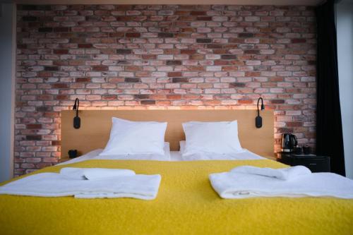 Katil atau katil-katil dalam bilik di Kragerø Hotell