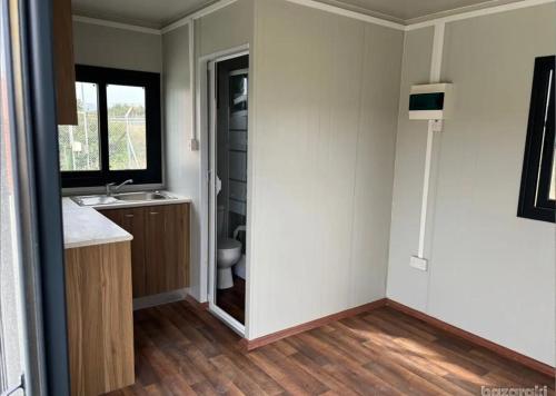 a bathroom with a sink and a toilet in a room at Anastasi Tiny Homes- Mountain Views, Garden & Terrace, Pet Friendly in Kakopetria