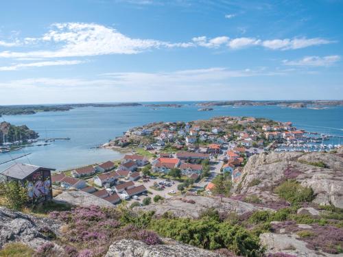 an aerial view of a small town on a hill next to the water at Panoramic view on Ellos top with 500m to sea in Ellös