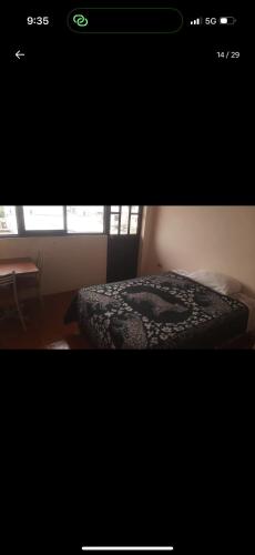 a screenshot of a bedroom with a bed in a room at Casa del sargento 