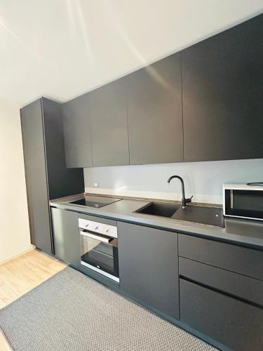 Kuchyň nebo kuchyňský kout v ubytování Residenza Cortemaggiore Luxury - Flexrent Immobiliare Abissinia