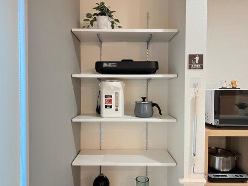 Una cocina o cocineta en The Sealions a newly built home 2 mins walk from supermarket