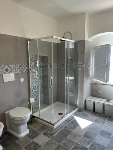 a bathroom with a shower and a toilet at Ripa di sassi in Manfredonia