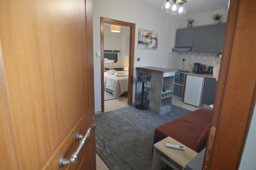 a room with a kitchen and a living room at Naya Lux Apt in Kastoria
