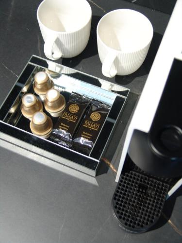 a tray of food on a counter with bowls at Apartment LUXOR - Airport Katowice-Pyrzowice in Bobrowniki