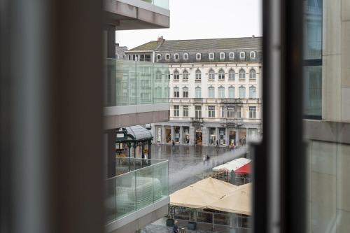 a view of a city street from a window at Ostend Central Residence in Ostend