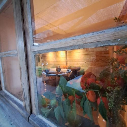 a view of a room through a window at Coume a Case - Gîte 4 étoiles - Charme et nature Vallée d Ossau in Lys