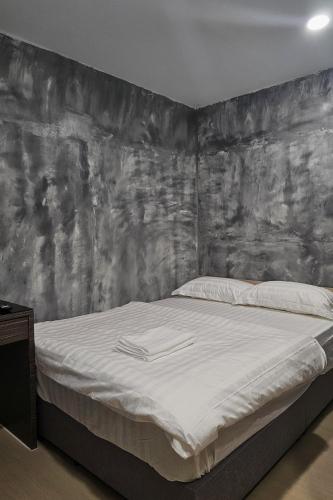 Postel nebo postele na pokoji v ubytování The Cozy Hotel