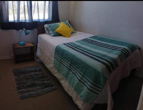 Ένα ή περισσότερα κρεβάτια σε δωμάτιο στο Quilpue condominium apartment