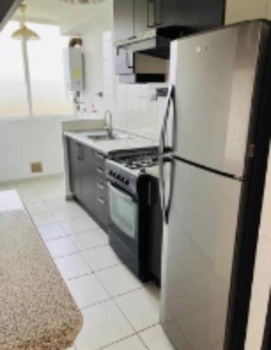 Η κουζίνα ή μικρή κουζίνα στο Quilpue condominium apartment