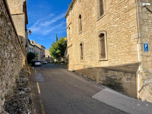 an empty street in an old stone building at locastillon in Castillon-du-Gard