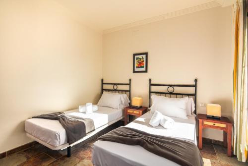 Postel nebo postele na pokoji v ubytování El Rincon del Golf III - Isla Canela Golf GRHIII112P122