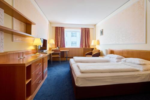 Hotel Strudlhof Viennaにあるベッド