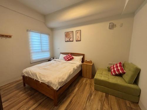 Postel nebo postele na pokoji v ubytování Xunfeng B&B