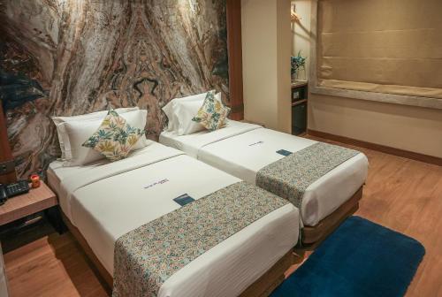 Postel nebo postele na pokoji v ubytování Planet Boutique Hotel
