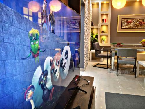 a room with a wall with a mural of pikachu at High Residence - Spacious & Lux Apt in Muscat