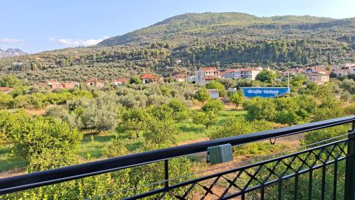 a view of a town from a balcony at Akrata Green Elite Apartments in Akrata