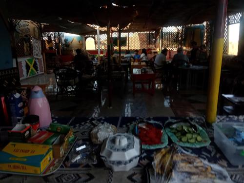 a table with food on it in a restaurant at Bob Marley Peace hotel luxor in Luxor
