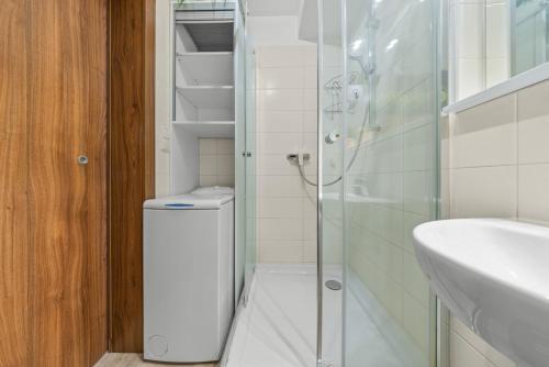 a bathroom with a shower and a toilet and a sink at 1-bedroom apartment with balcony, Rustaveliho - Rača in Bratislava