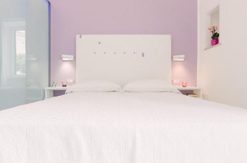 Una cama o camas en una habitación de Ravello In