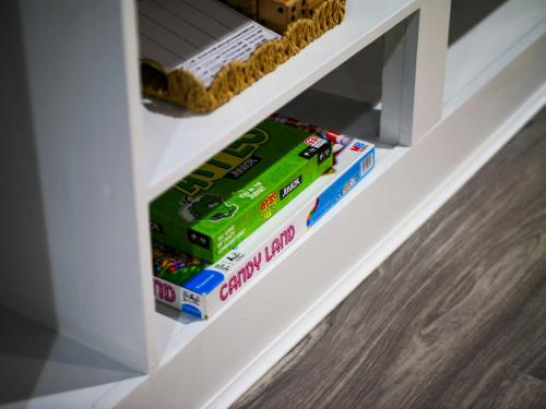 a white shelf with boxes of lego at Ellendale Rd Moreland Hills 