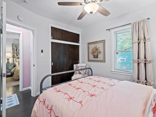 a bedroom with a bed and a ceiling fan at Ellendale Rd Moreland Hills 