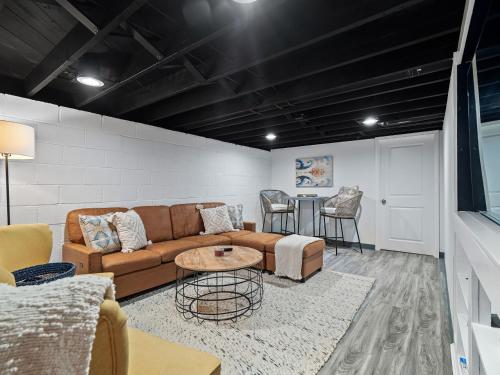 a living room with a couch and a table at Ellendale Rd Moreland Hills 