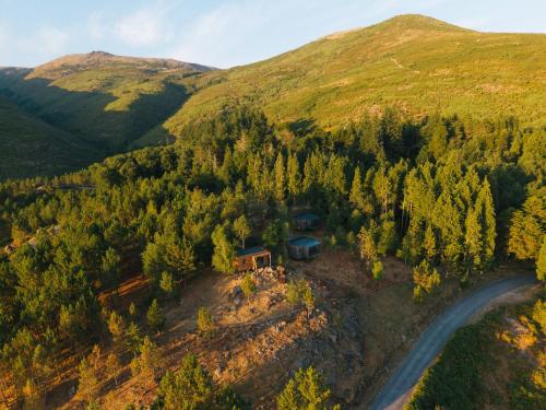an aerial view of a house on a hill with a road at Bungalows da Travanca in Arcos de Valdevez