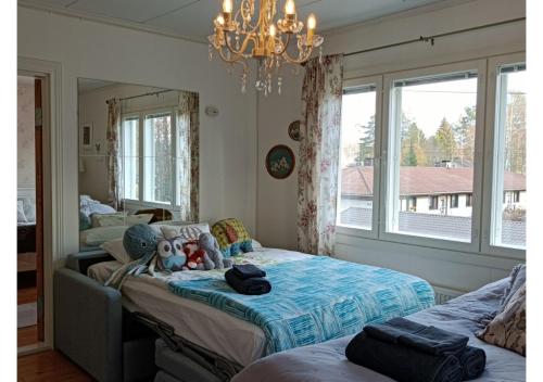 Postel nebo postele na pokoji v ubytování Huoneistomajoitus Unelma Mäntyharju