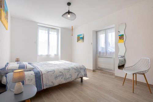 Ένα ή περισσότερα κρεβάτια σε δωμάτιο στο Appartement Penfret Plain-pied