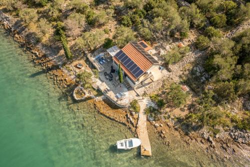 an aerial view of a house with a solar roof at Villa Zora ZadarVillas - private island retreat in Sali