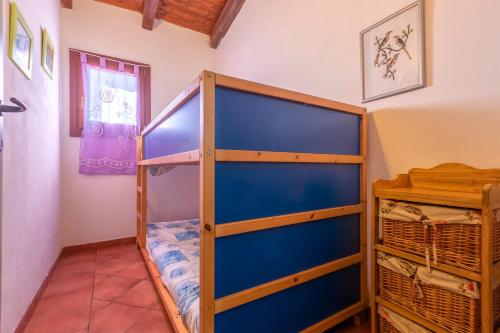 a bunk bed room with a bunk bed in a room at Rifugio Del Sognatore Stintino in Cuile Pazzoni