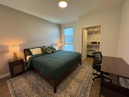 a bedroom with a bed and a table and a window at Upscale Escape 10 Min from Disneyland With Pool & Gym in Tustin