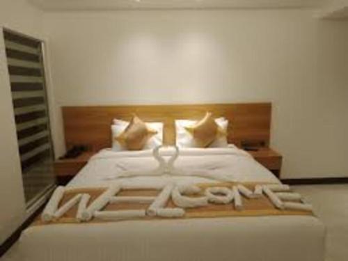 Cama o camas de una habitación en Hotel X Rajshahi