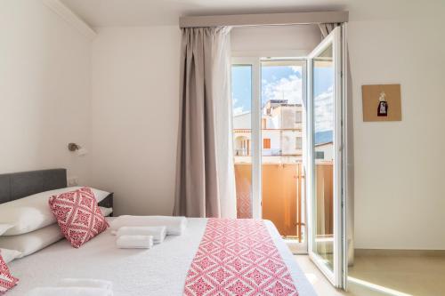 Ένα ή περισσότερα κρεβάτια σε δωμάτιο στο Centenari Longevity Rooms Lotzorai