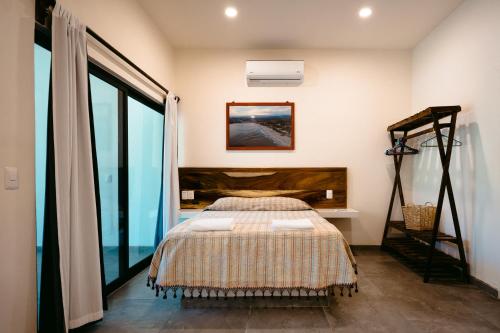 Ένα ή περισσότερα κρεβάτια σε δωμάτιο στο Bungalows Oasis